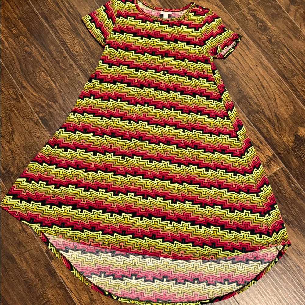 Short sleeve" Carly style" dress. Longer in front, shorter in back.